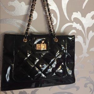 Black and gold also handbag. Pu leather, quilted.